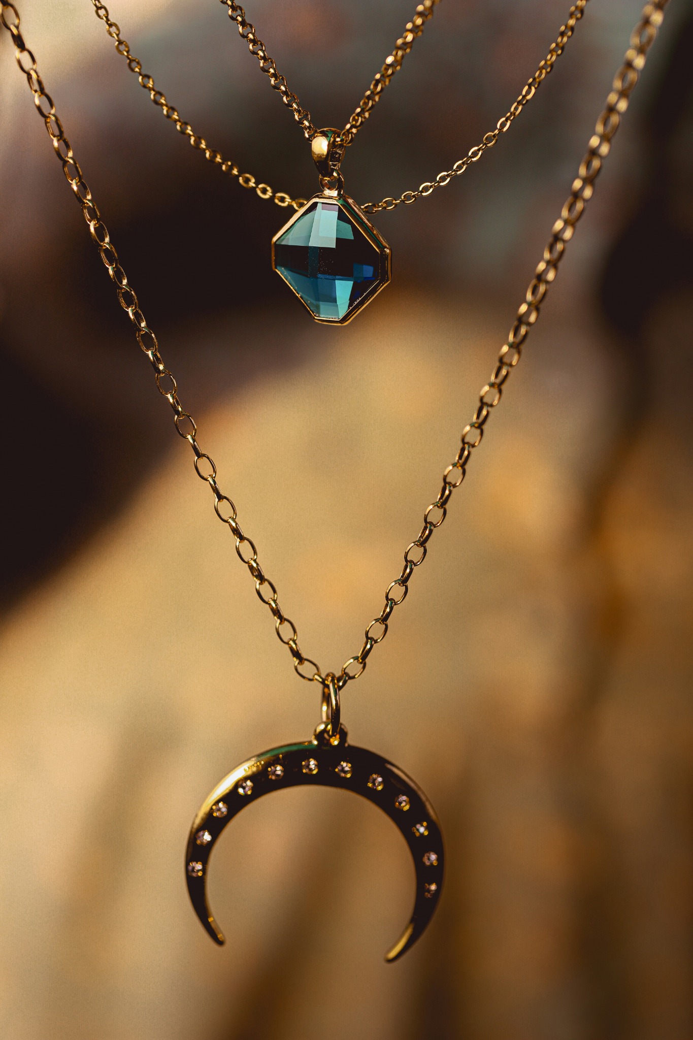 Gold necklaces with turquoise and crescent charms
